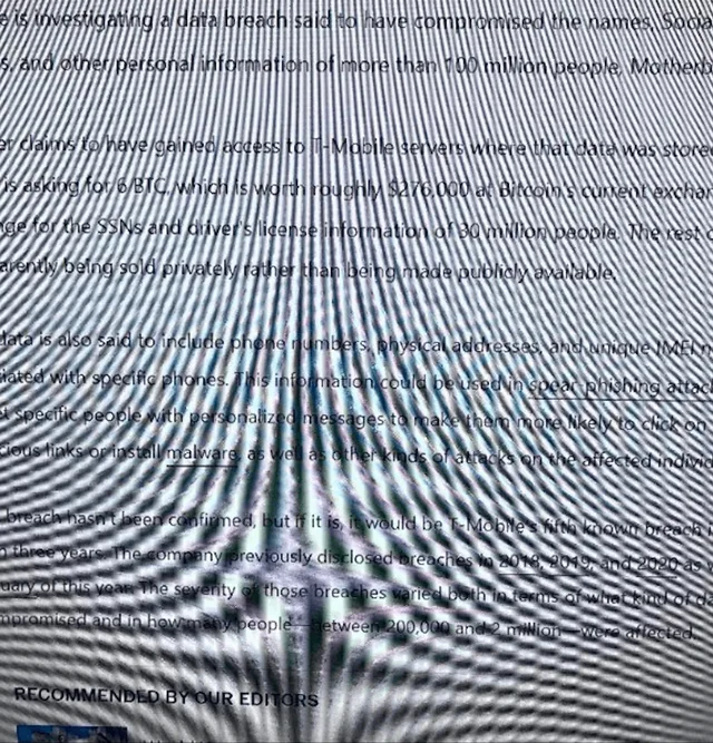 Screen photo of a news article with wavy lines